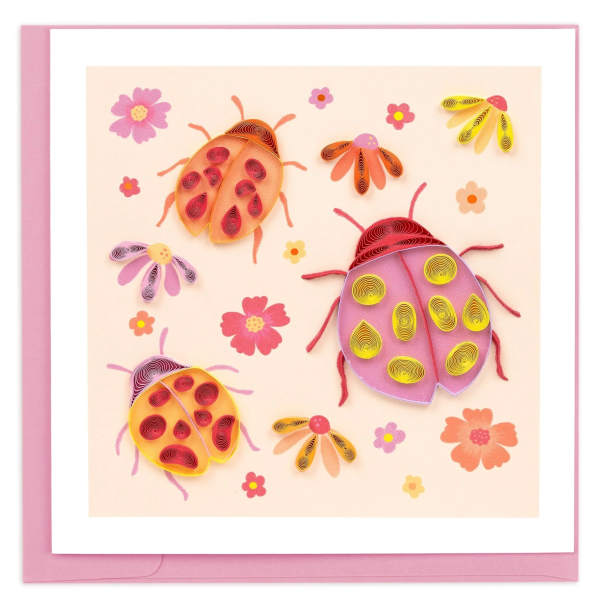 Pink greeting card with colorful paper ladybugs and flowers