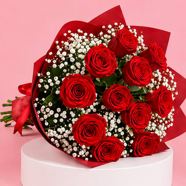 Bouquet of red roses with white baby's breath in red wrap