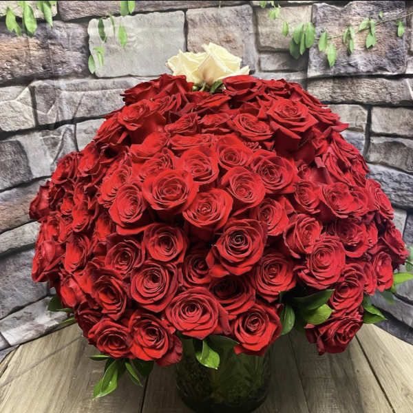 Large bouquet of red roses with a few white roses at the top