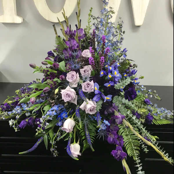 Large purple and blue floral spray with roses and iris
