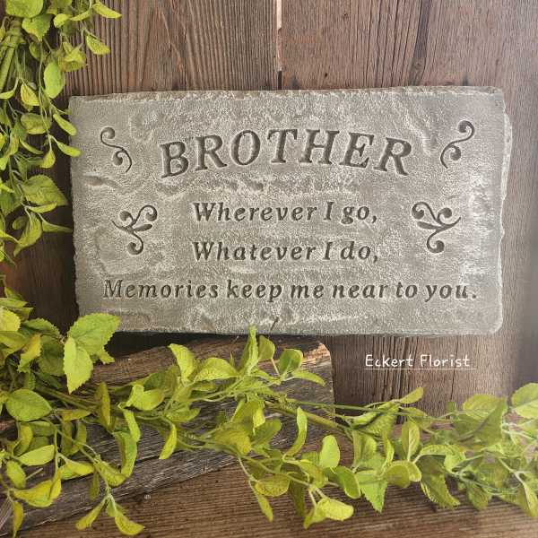 Stone memorial plaque engraved with the word Brother and a short verse