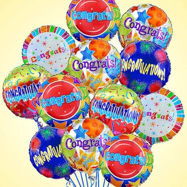 Cluster of colorful congratulatory balloons with star patterns