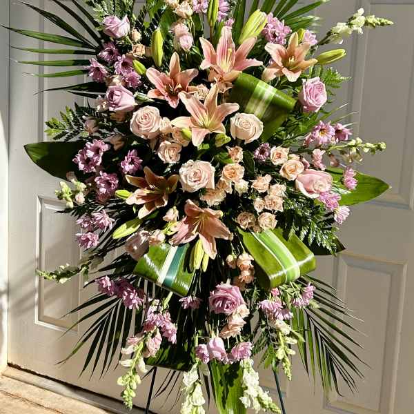Large standing floral spray with pink lilies and roses