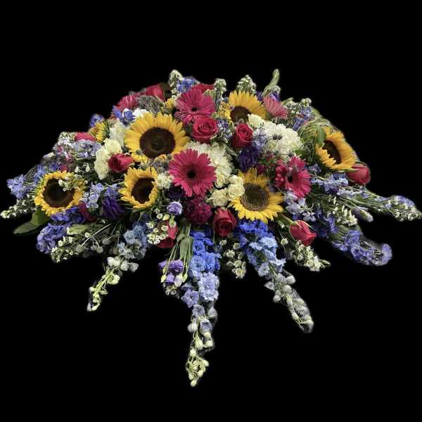 Large mixed flower spray with sunflowers, pink gerberas, and roses