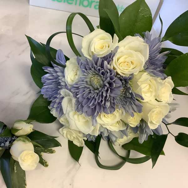 White roses and lavender chrysanthemums with greenery, plus a matching boutonniere