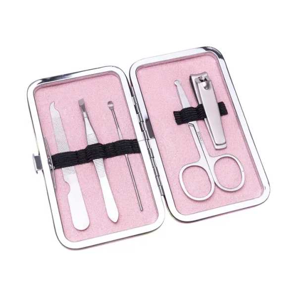 Pink manicure kit in an open metal case with nail tools