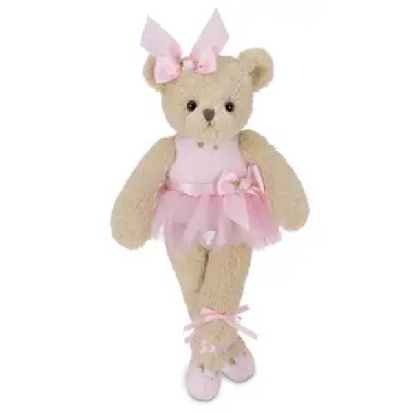 Teddy bear in a pink dress with a bow and ballet slippers