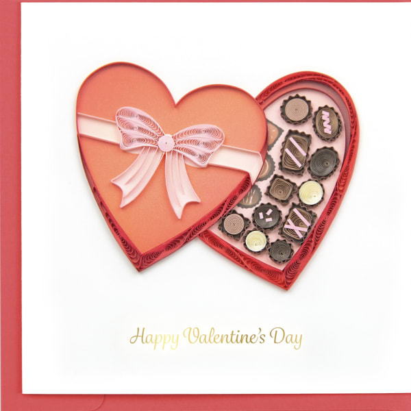 Heart-shaped Valentine card with a pink bow and small paper quilled hearts