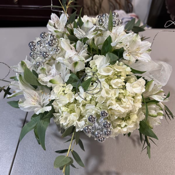 White floral bouquet with silver decorative accents