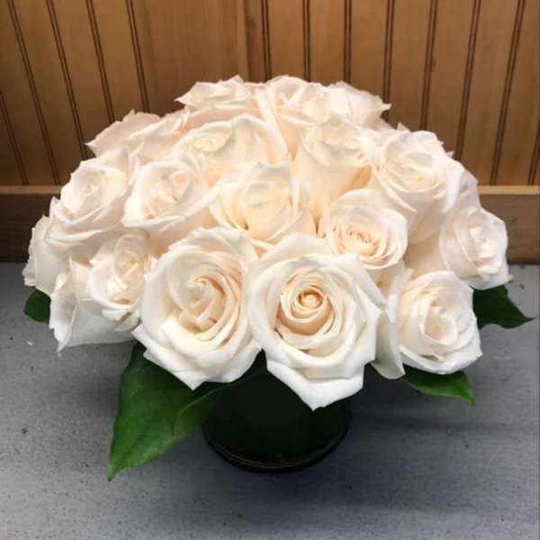 White rose bouquet in a black vase