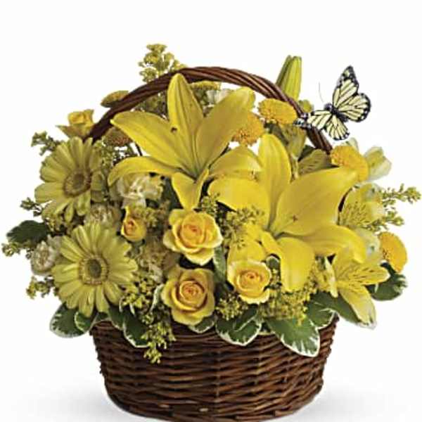 Yellow floral basket arrangement with lilies and roses