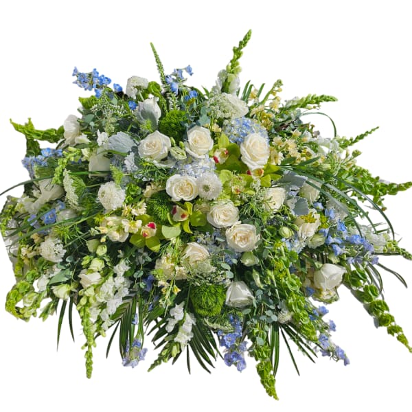 Large white and blue floral spray with roses and mixed blooms