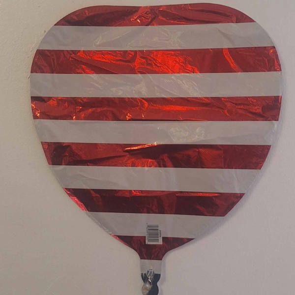 Red and white striped heart-shaped foil balloon