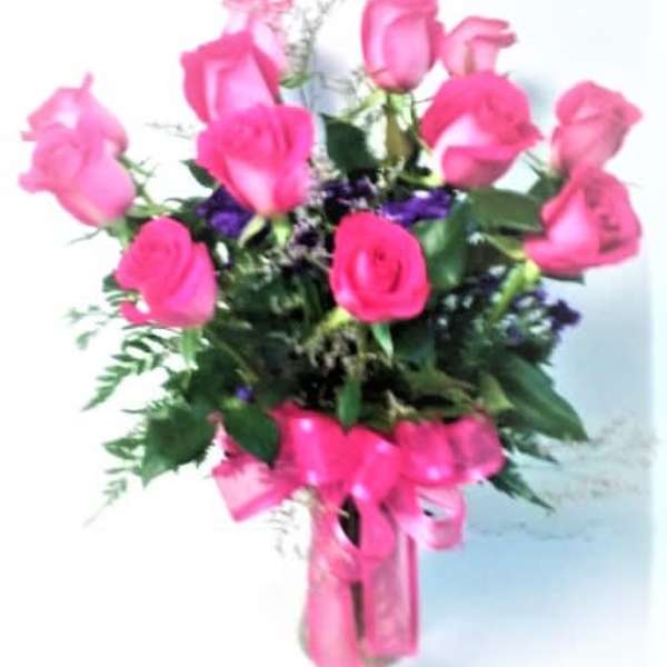 Bouquet of pink roses with a pink ribbon