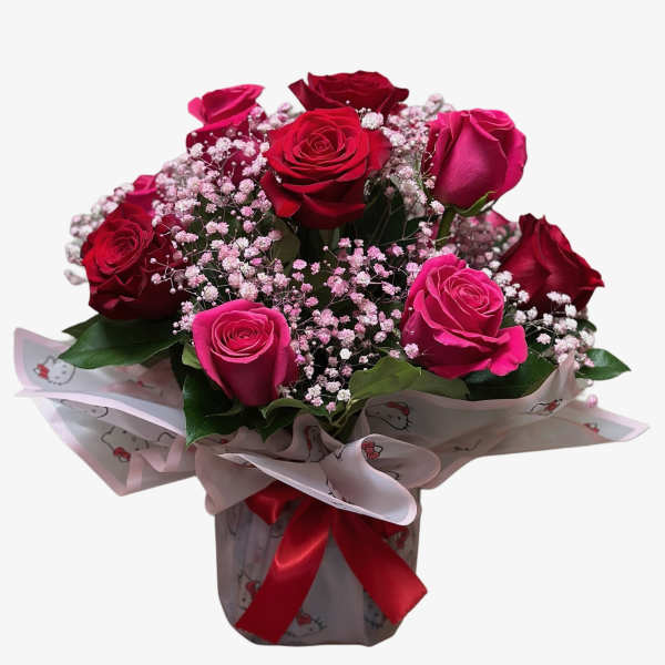 Bouquet of red and pink roses with baby's breath in wrapped paper