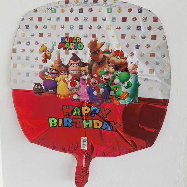 Super Mario birthday foil balloon with characters and red bottom panel