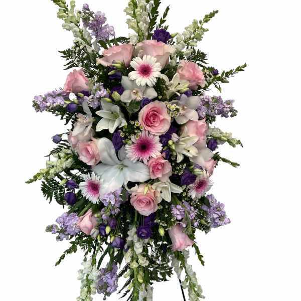 Standing floral spray with pink, white, and purple flowers