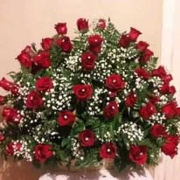 Large bouquet of red roses with white filler flowers