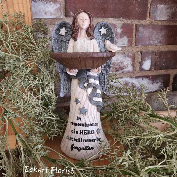 Angel memorial figurine holding a bowl with a small bird