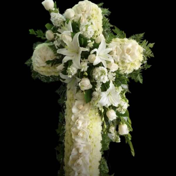 White floral cross arrangement with lilies and roses