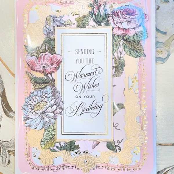 Birthday card with pastel floral border and gold trim