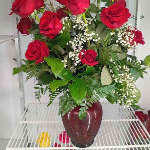 1 dozen red roses with mix greens and flowers