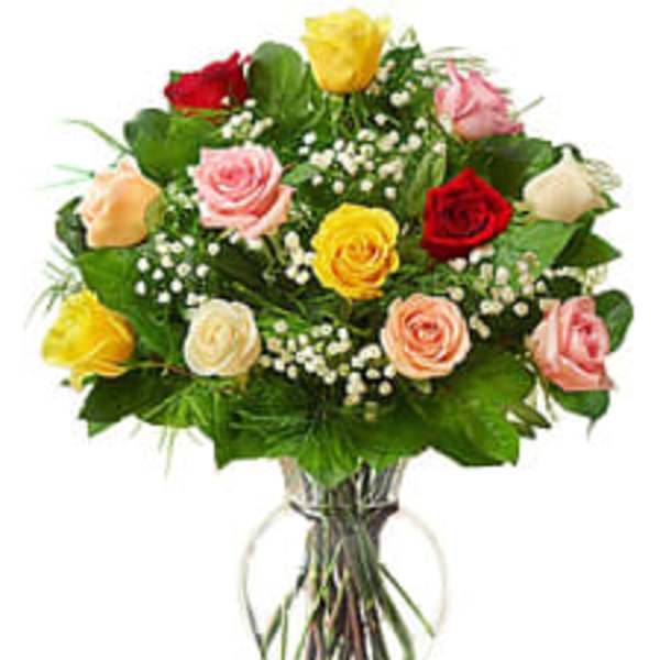 Bouquet of multicolored roses in a clear glass vase
