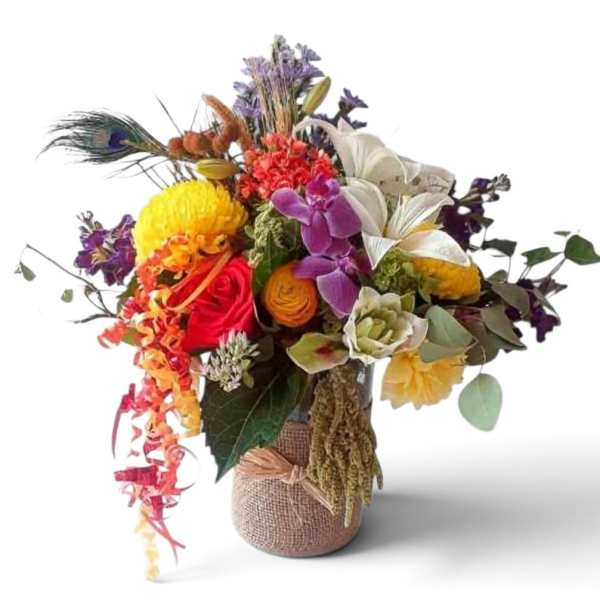 Colorful mixed bouquet in a burlap-wrapped vase with peacock feathers