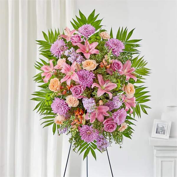 Pink and lavender floral standing spray on an easel