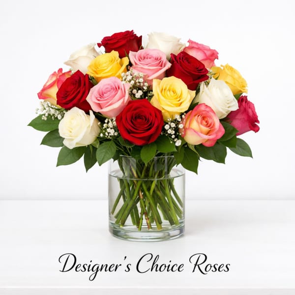 Mixed roses in a clear glass vase