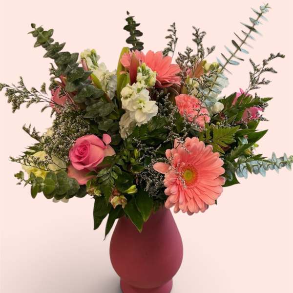 Pink and white mixed flower arrangement in a vase