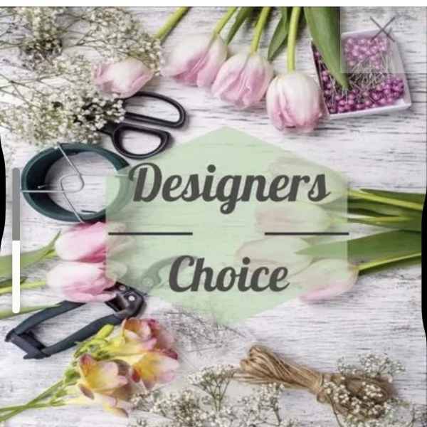 Flat lay of pink tulips, white filler flowers, and floral tools around Designers Choice text.