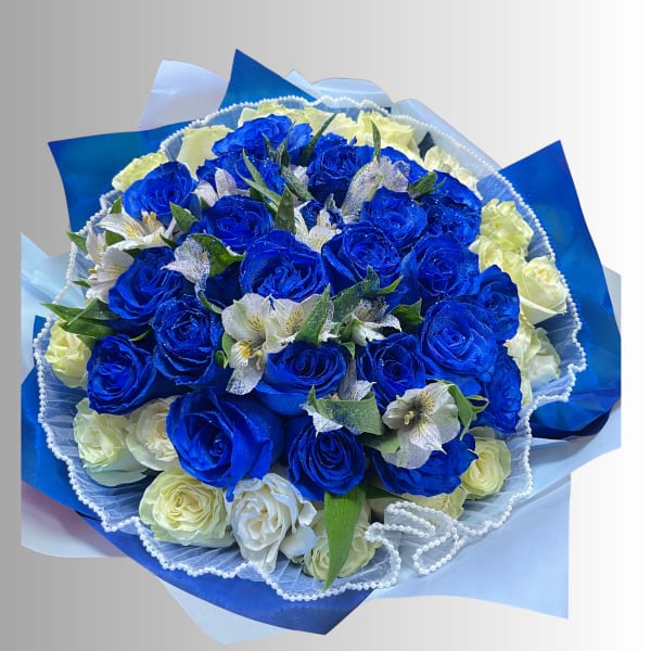 Bouquet of blue and white roses with small white flowers wrapped in blue paper