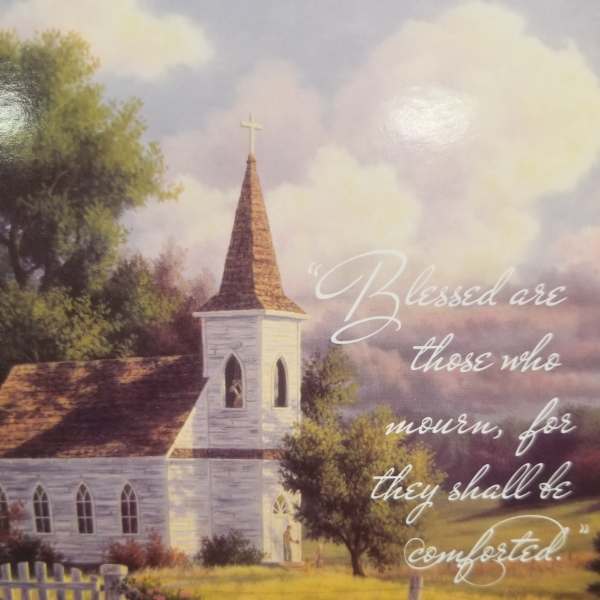 Quilted throw with a church scene and Bible verse text