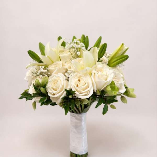 White rose and lily bridal bouquet with green buds and baby's breath