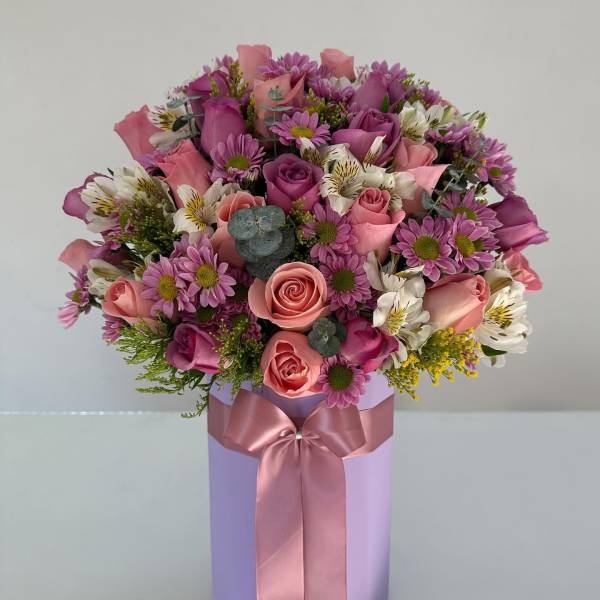 Pink and purple mixed bouquet in a lavender box with a satin ribbon