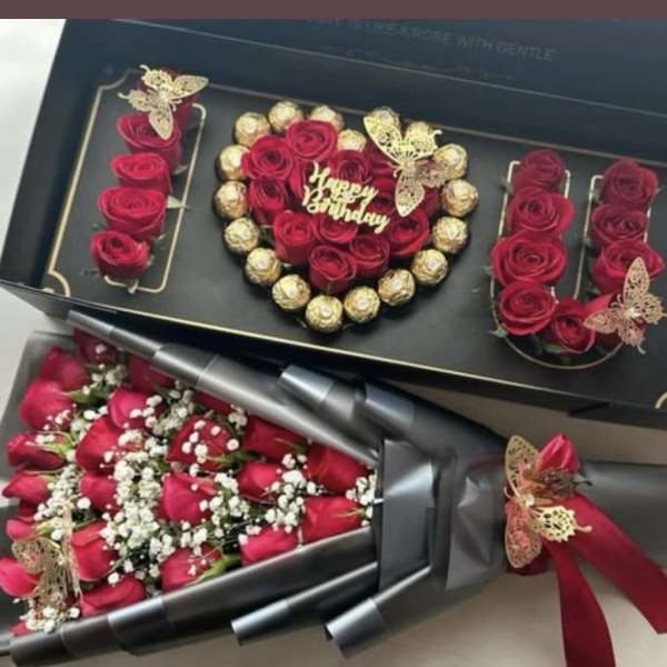 Gift box with red roses and chocolates, plus a bouquet of red roses wrapped in black paper