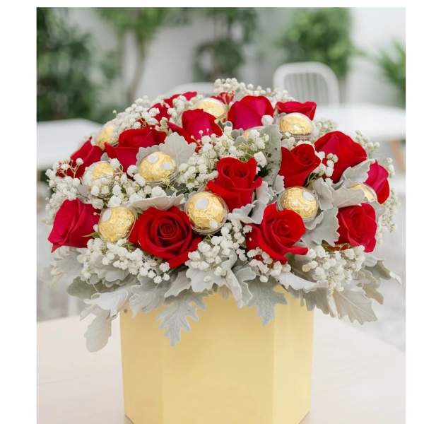 Red roses with gold chocolates in a yellow box