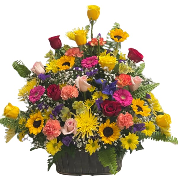 Mixed bouquet of roses, sunflowers, and carnations in a black basket