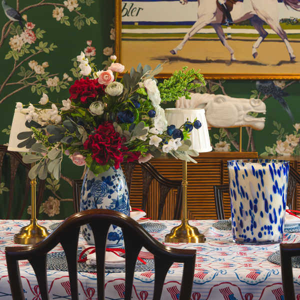 Floral centerpiece in a blue-and-white vase on a decorated table
