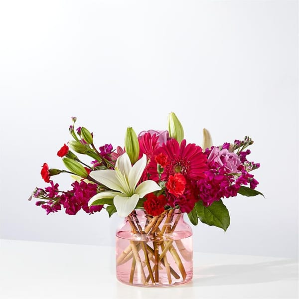 Pink and white mixed bouquet in a glass vase