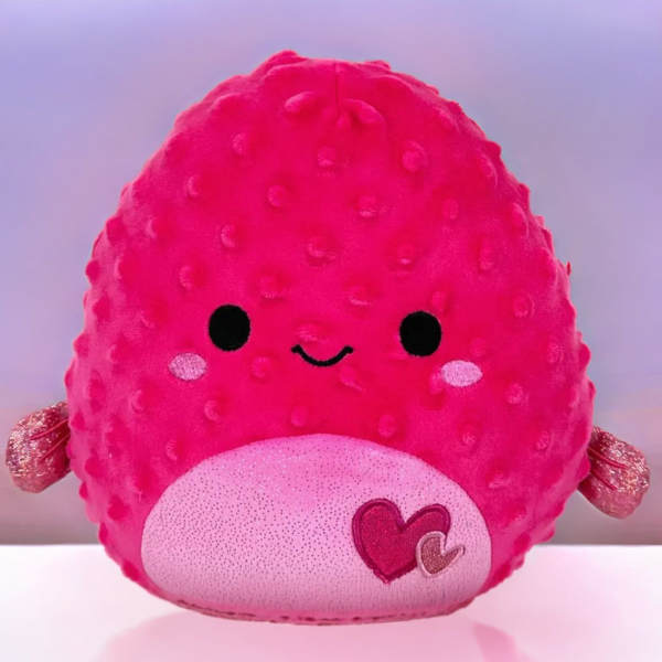 Bright pink heart-themed plush character toy with a smiling face and textured body.