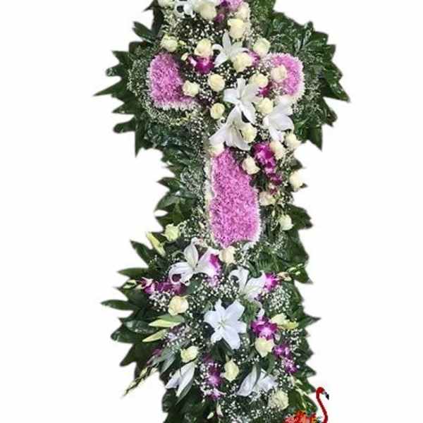 Tall floral standing spray with white, pink, and purple flowers