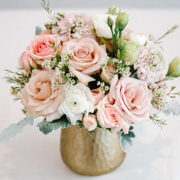 Blush and white rose bouquet in a gold vase