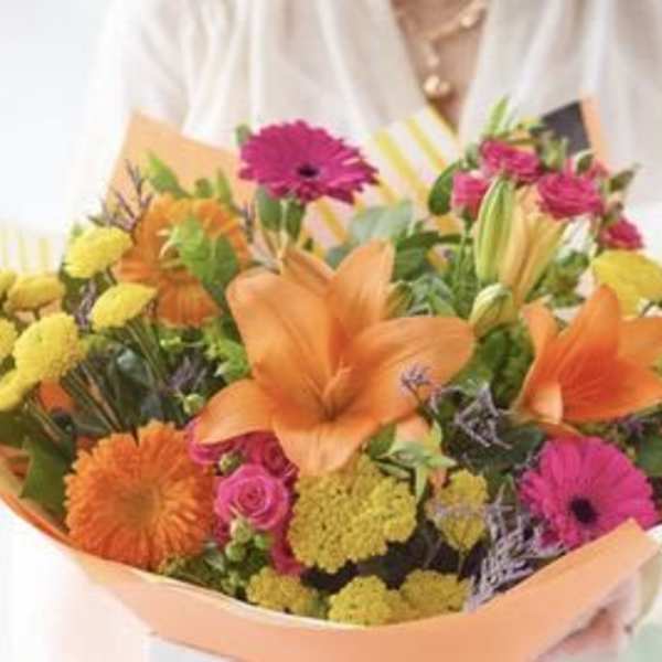Bright mixed bouquet with orange lilies, pink gerberas, and yellow blooms