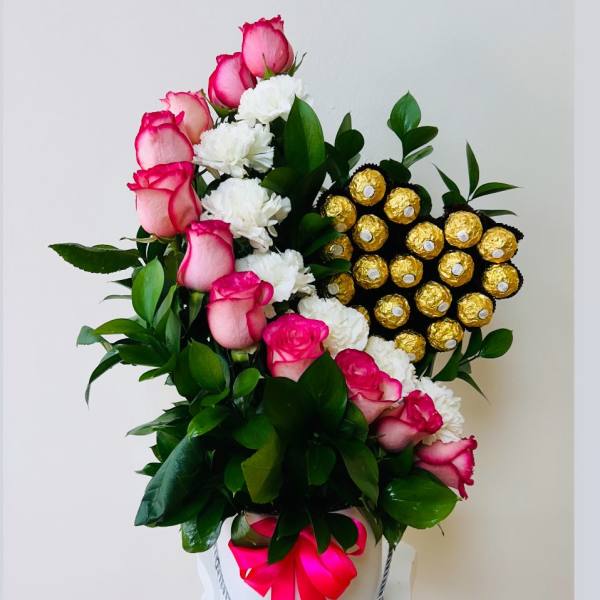 Pink roses and white carnations in a white hatbox with gold chocolates