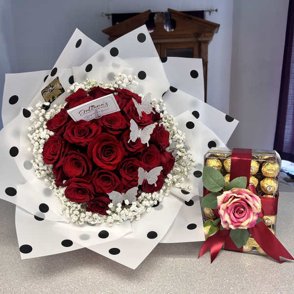 Red rose bouquet with baby’s breath and a box of chocolates