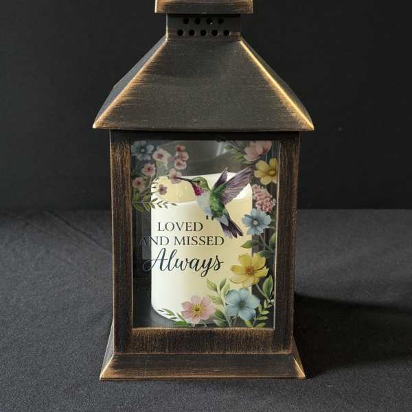 Decorative lantern with a memorial candle and floral print