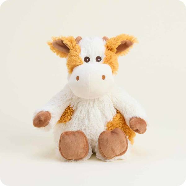 Plush cow toy with white and orange fur