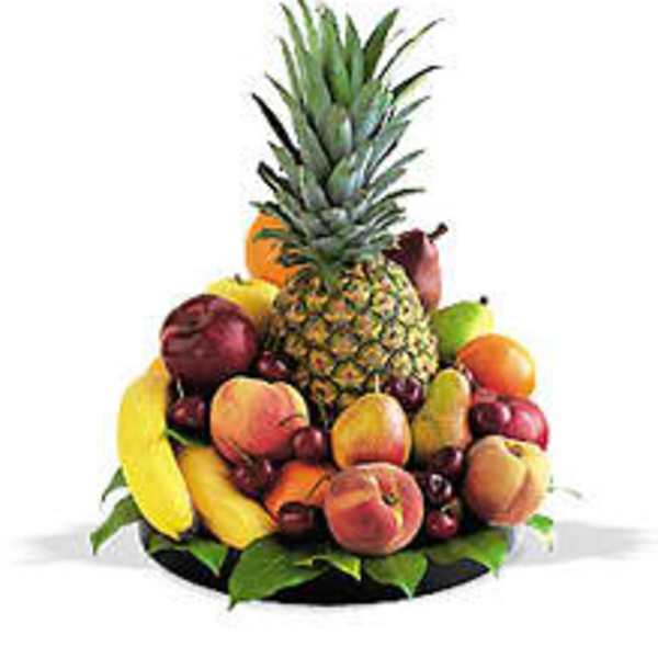 Tropical fruit arrangement with a pineapple, bananas, apples, and pears
